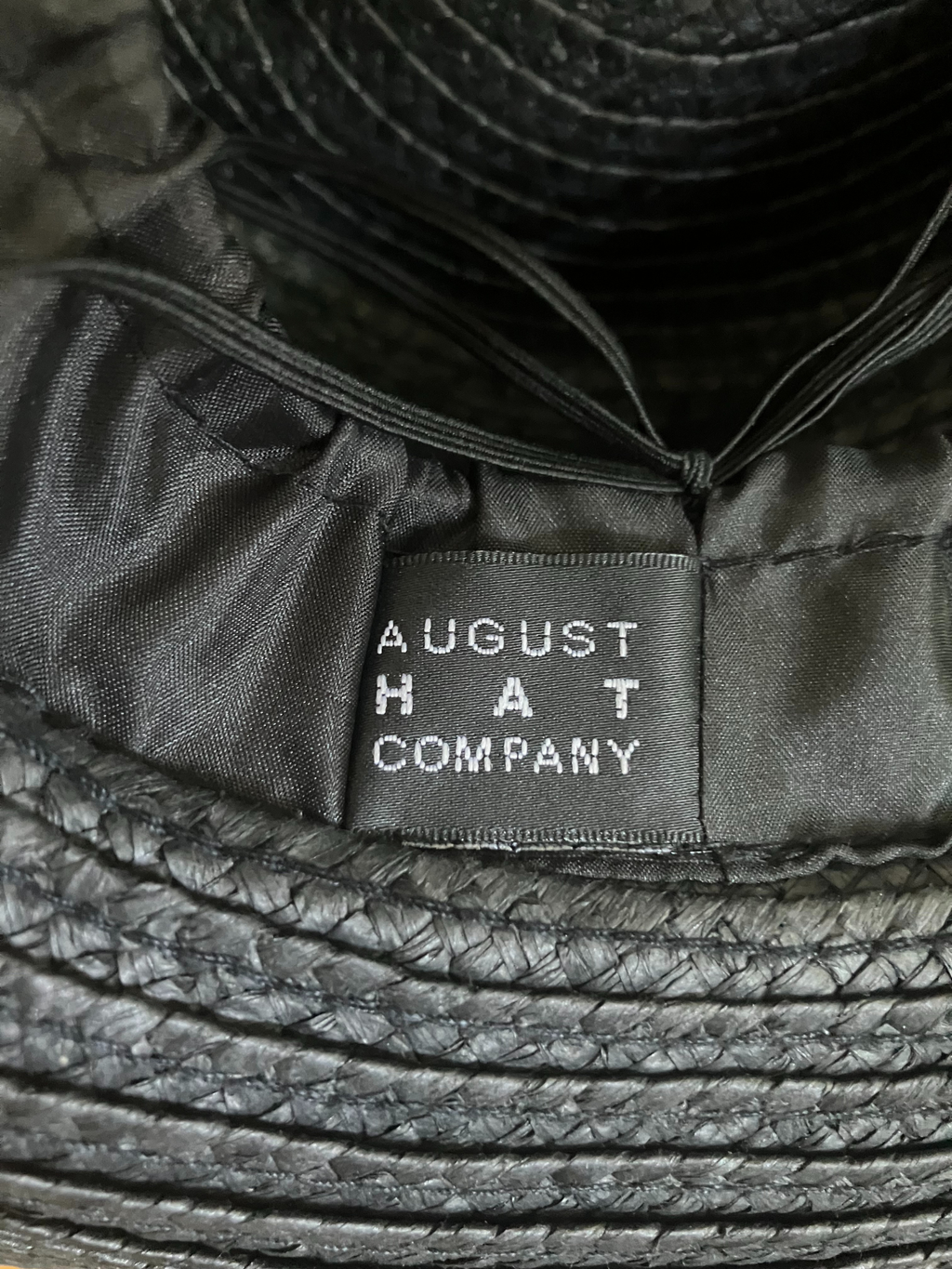 August Hat Company Black Wide Brim Straw Hat - Floral Embellishment