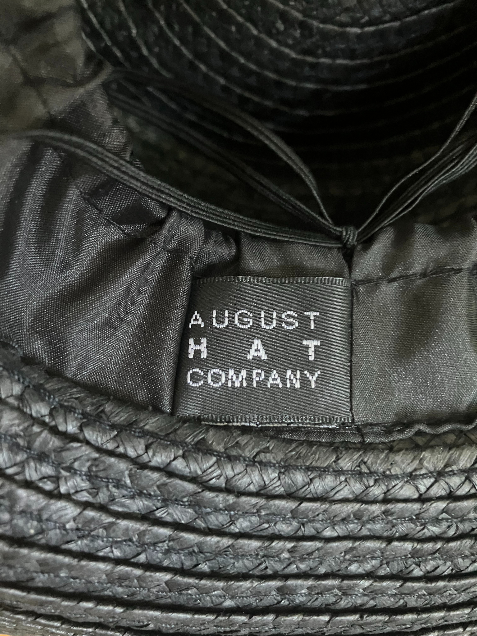 August Hat Company Black Wide Brim Straw Hat - Floral Embellishment