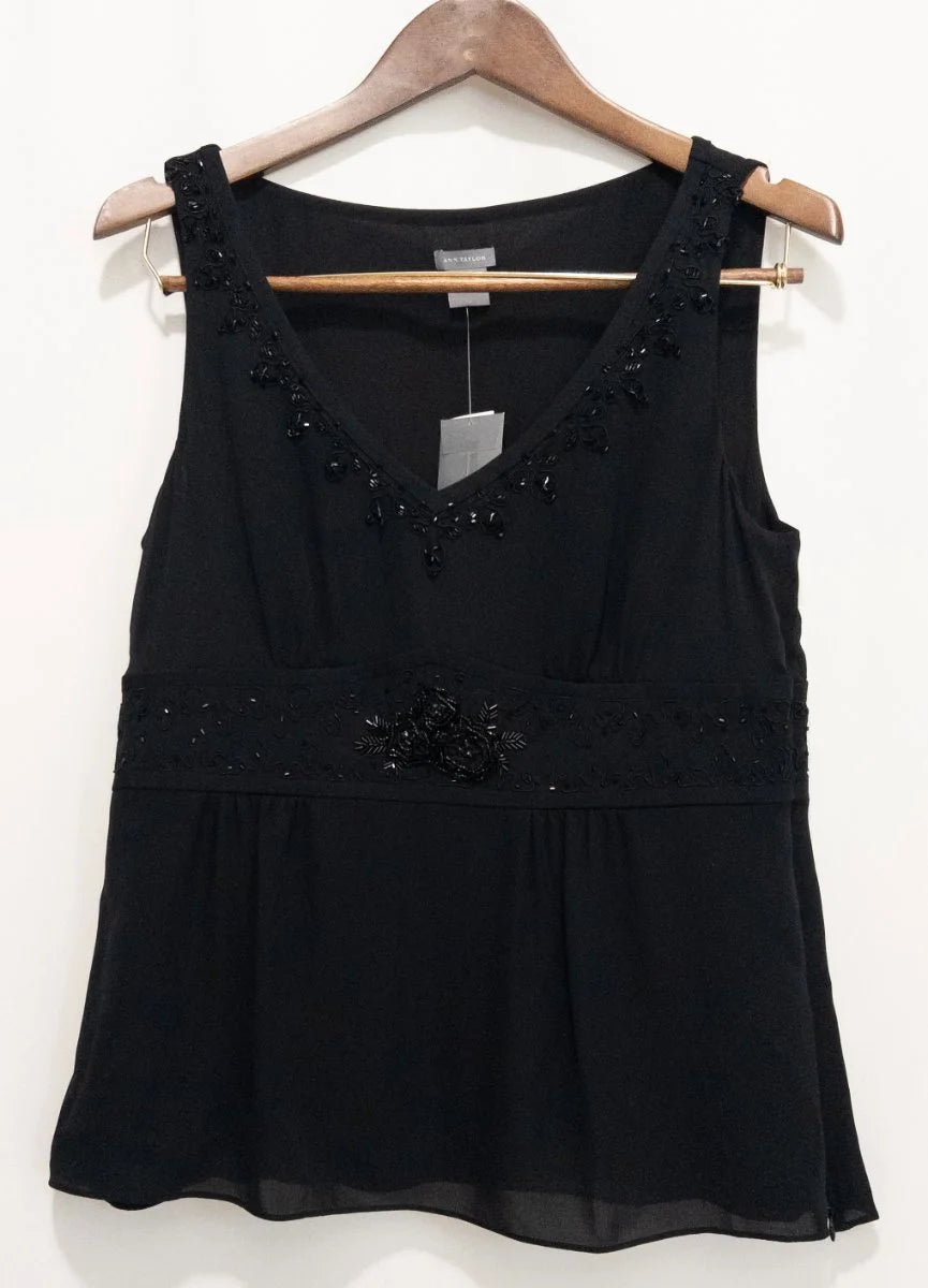Ann Taylor — Blouse | Not every black blouse earns the room — this one does · Sz 10