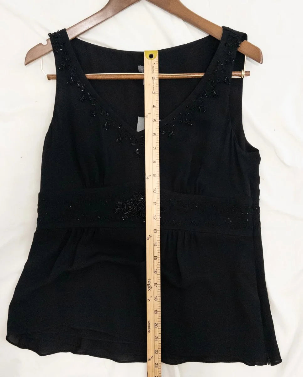 Ann Taylor — Blouse | Not every black blouse earns the room — this one does · Sz 10