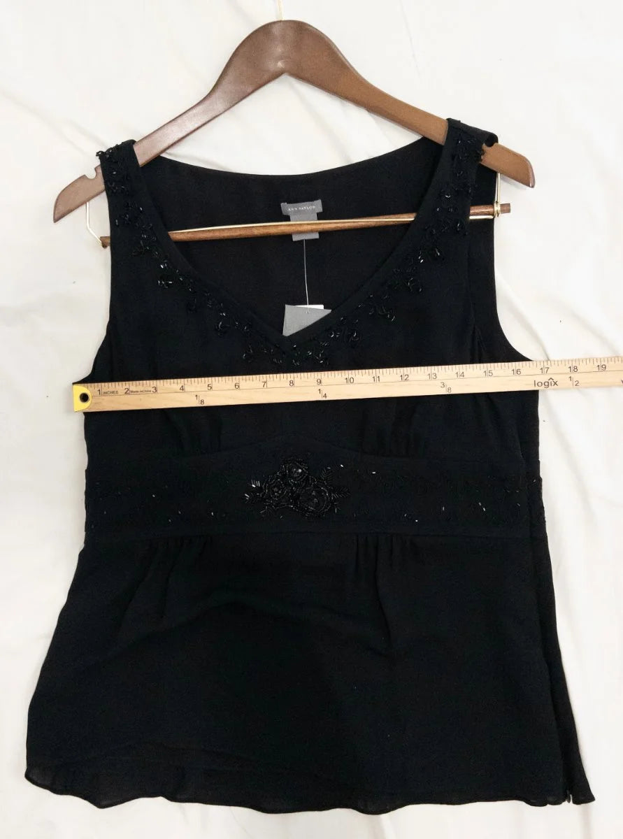 Ann Taylor — Blouse | Not every black blouse earns the room — this one does · Sz 10