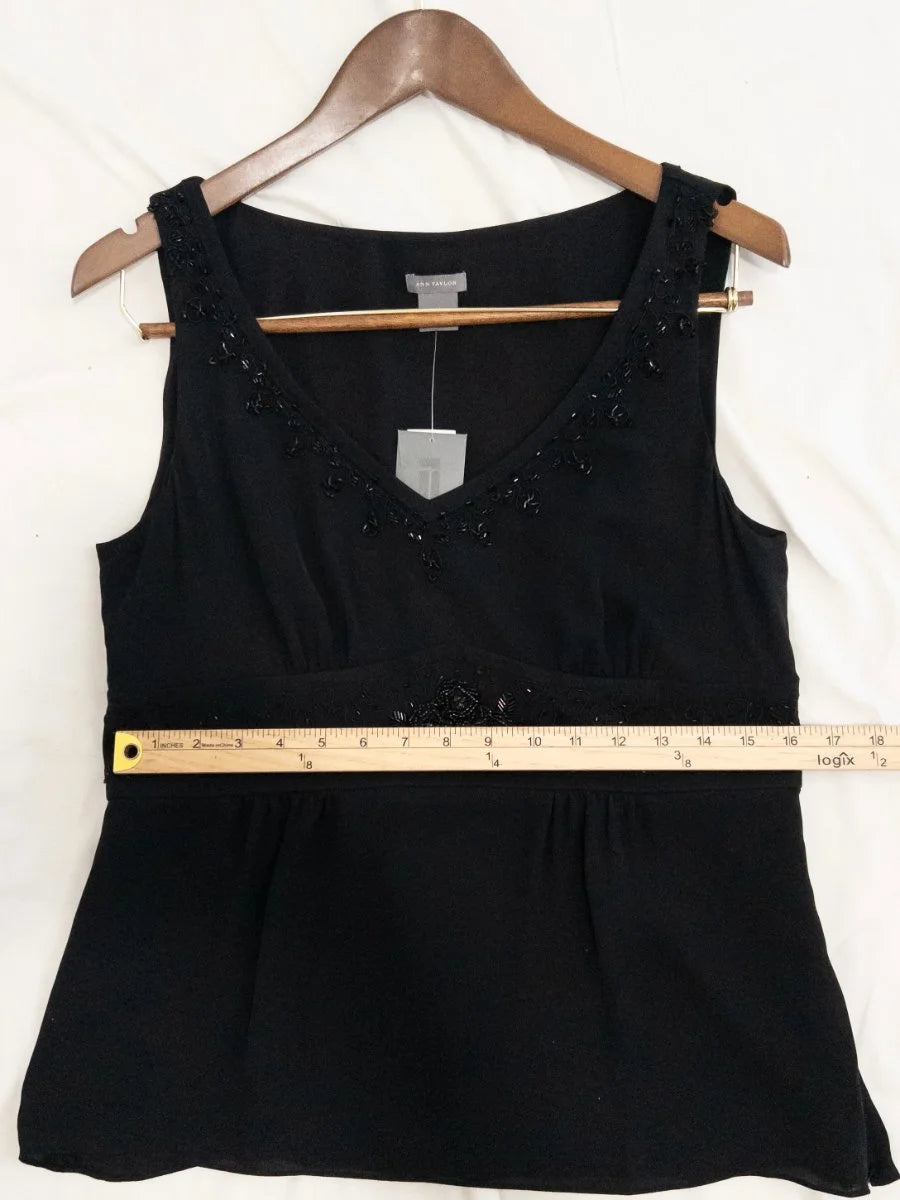 Ann Taylor — Blouse | Not every black blouse earns the room — this one does · Sz 10