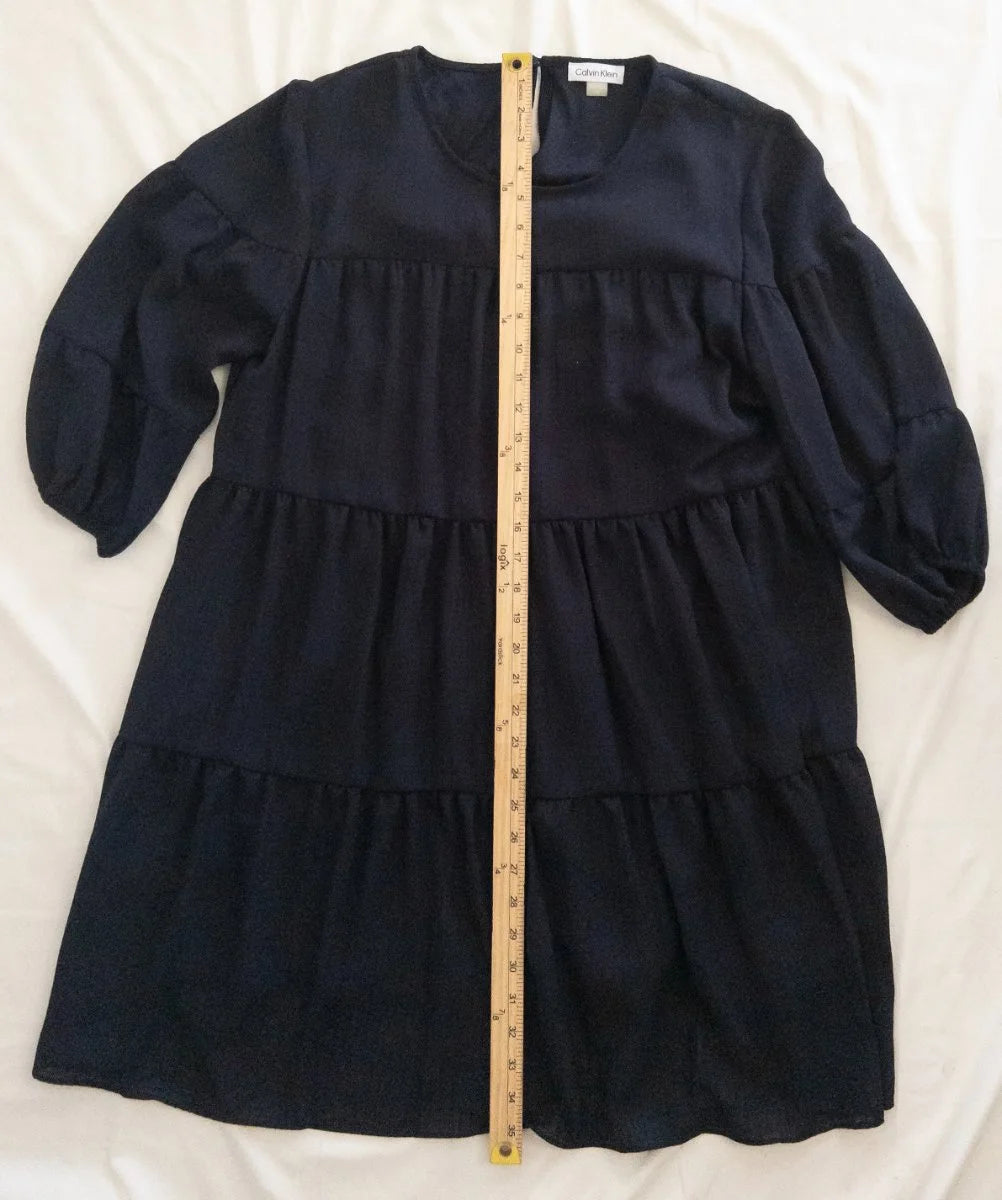 Calvin Klein — Dress | Not every dress asks for the room — this one takes it · Sz 14