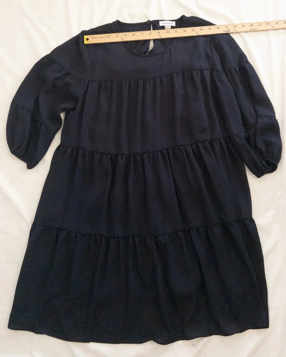 Calvin Klein — Dress | Not every dress asks for the room — this one takes it · Sz 14