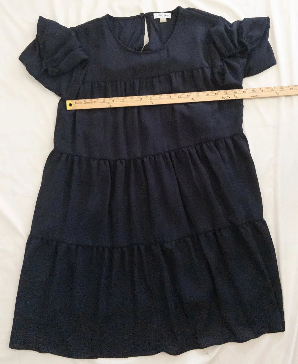 Calvin Klein — Dress | Not every dress asks for the room — this one takes it · Sz 14