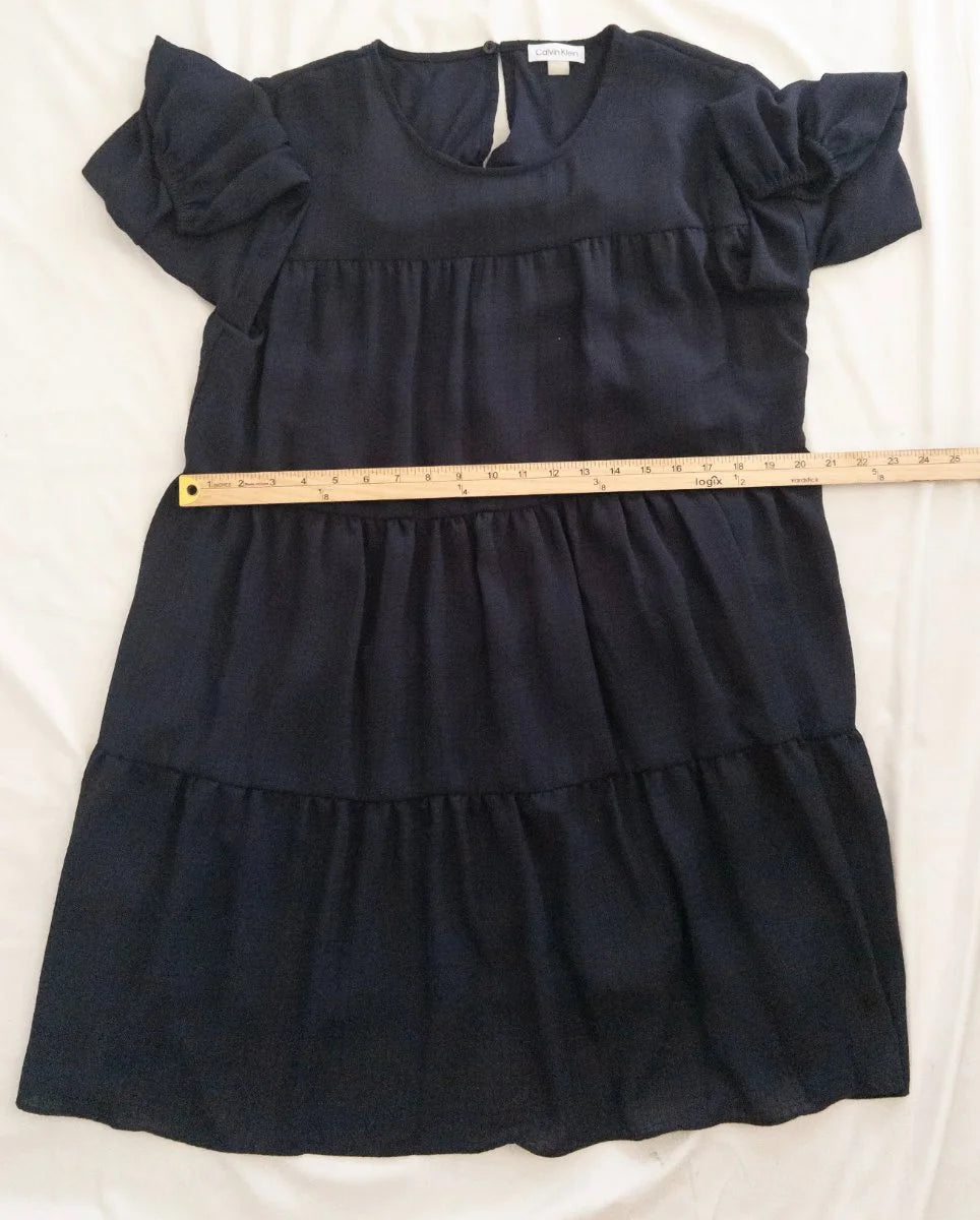 Calvin Klein — Dress | Not every dress asks for the room — this one takes it · Sz 14