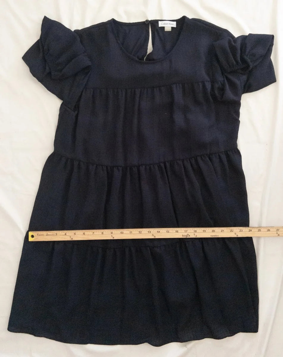 Calvin Klein — Dress | Not every dress asks for the room — this one takes it · Sz 14