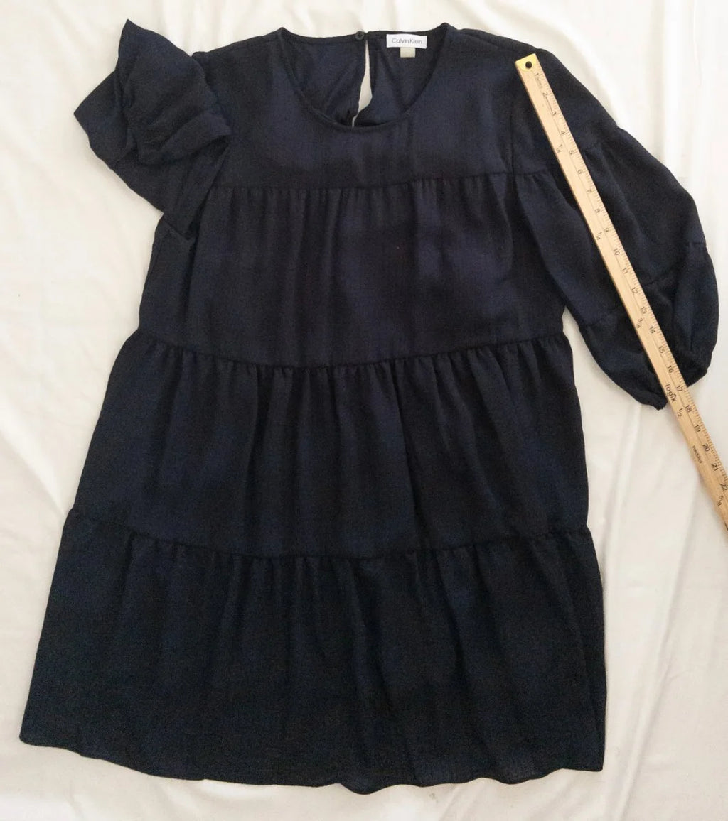 Calvin Klein — Dress | Not every dress asks for the room — this one takes it · Sz 14