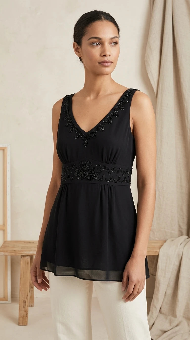 Ann Taylor — Blouse | Not every black blouse earns the room — this one does · Sz 10